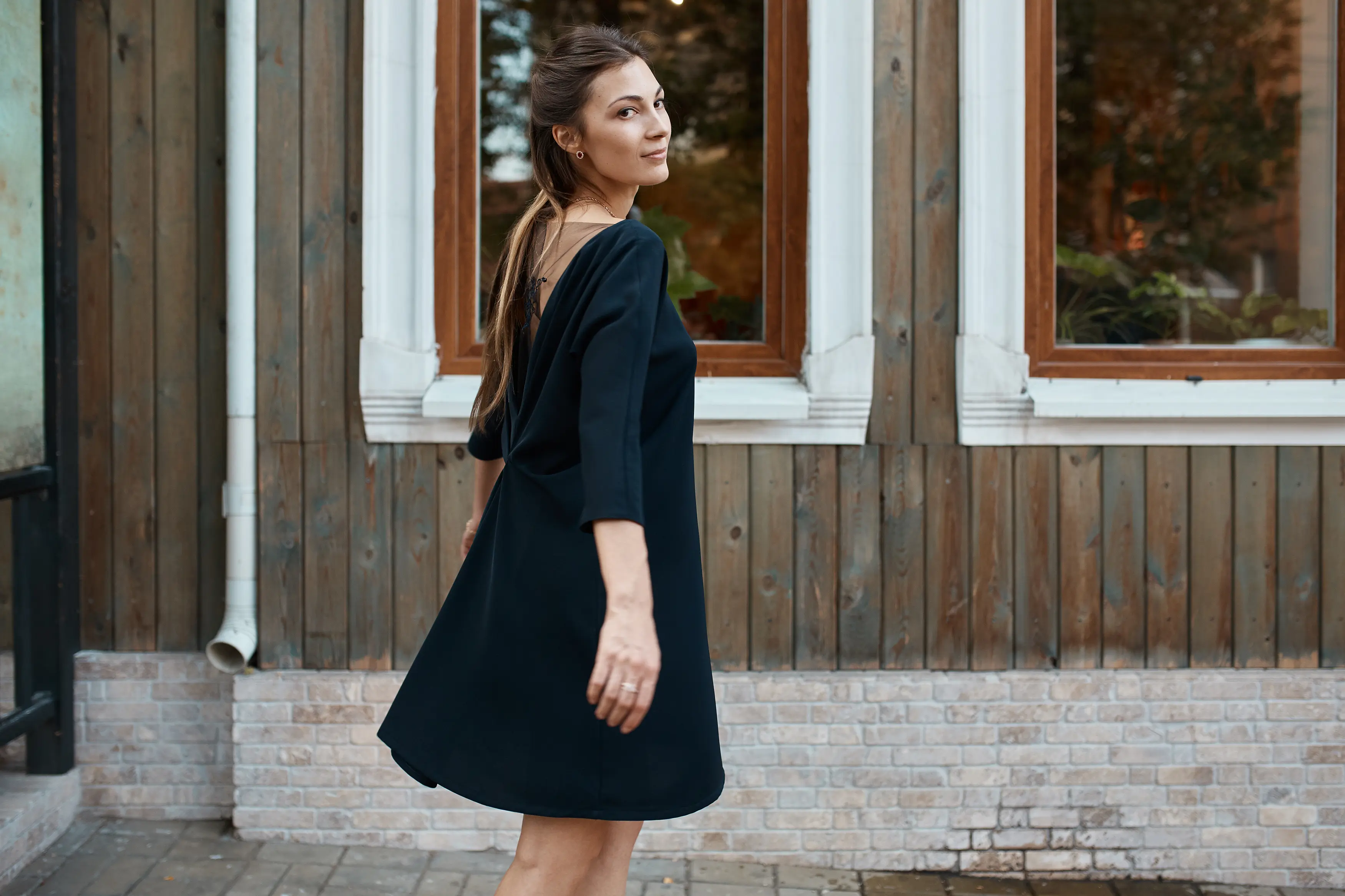 "Elegant woman in a black summer dress"