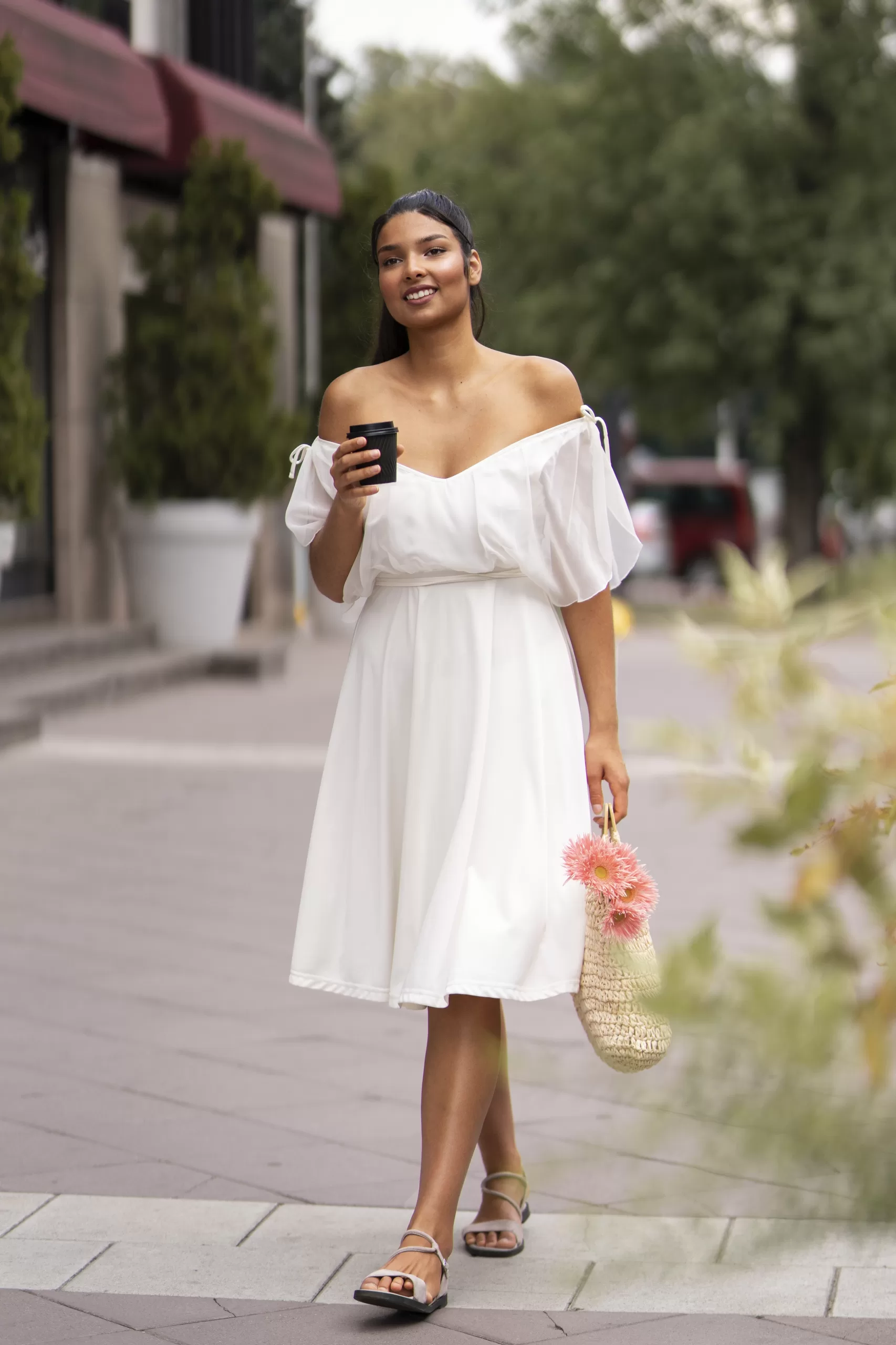 "Woman in a flowing white summer dress