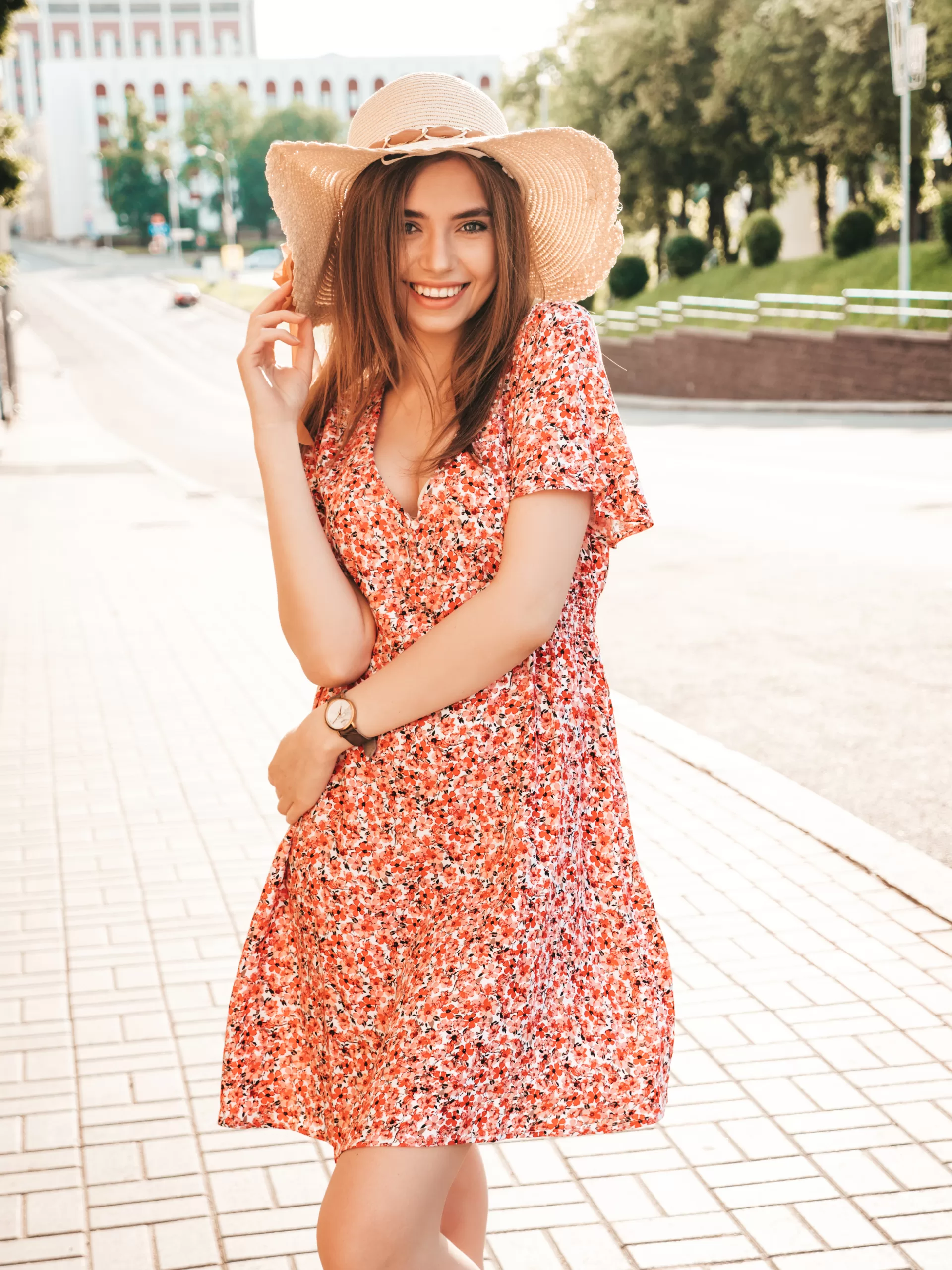 "Woman wearing a vibrant floral print summer dress"